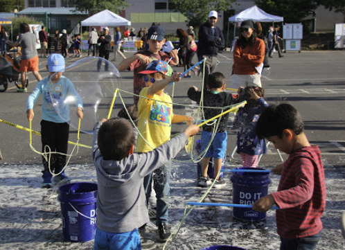 students playing with bubbles at the festival