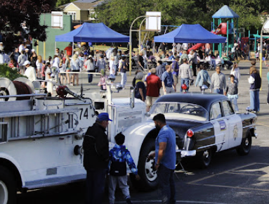 fire truck and police car at the festival
